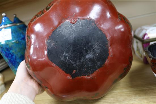 A Chinese lacquer pumpkin shaped box and cover